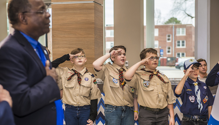 Cub Scouts from Scales and Rockvale elementary schools lead the Pledge of Allegiance Wednesday, March 7, before the signing of an agreement between MTSU and the Middle Tennessee Council of the Boy Scouts of America that will allow the university to be a greater resource for scouting programs, particularly in science and technology. At left is MTSU President Sidney A. McPhee. The signing took place in the Strobel Lobby that connects the Davis Science Building and Wiser-Patten Science Hall. (MTSU photo by Eric B. Sutton)