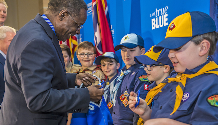 MTSU President Sidney A. McPhee presents tokens of appreciation to Cub Scouts from Scales and Rockvale elementary schools on Wednesday, March 7, following the signing of an agreement between MTSU and the Middle Tennessee Council of the Boy Scouts of America. The signing took place in the Strobel Lobby that connects the Davis Science Building and Wiser-Patten Science Hall. (MTSU photo by Eric B. Sutton)