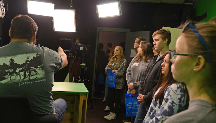 Blackman Collegiate Academy students listen as MTSU freshman Nate Parris, a video production major from Clarksville, Tenn., discusses cameras and other studio green room equipment March 13 during the students’ visit to campus and the Center for Innovation in Media.