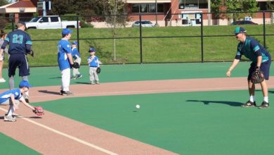 Players and buddies on the rubberized surface at Murfreesboro's Miracle Field in McKnight Park