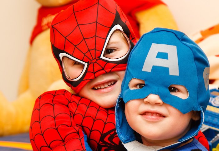 Kids in superhero costumes