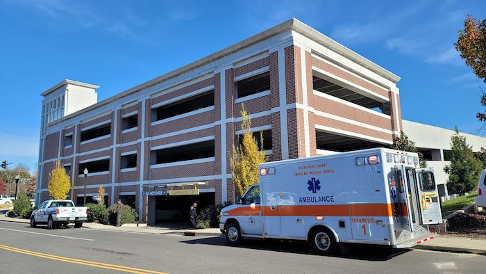 Man found dead in parking garage identified