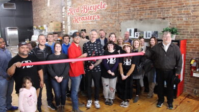 Ribbon Cutting for Red Bicycle on the Square