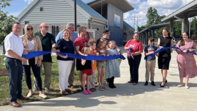 Discovery School Third Graders cut ribbon for Little Free Libraries