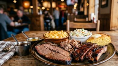 A plate of smoked brisket, pulled pork, ribs and Southern sides