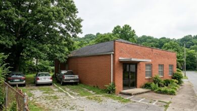 A modest brick community-services building and adjoining lot on a Murfreesboro side street