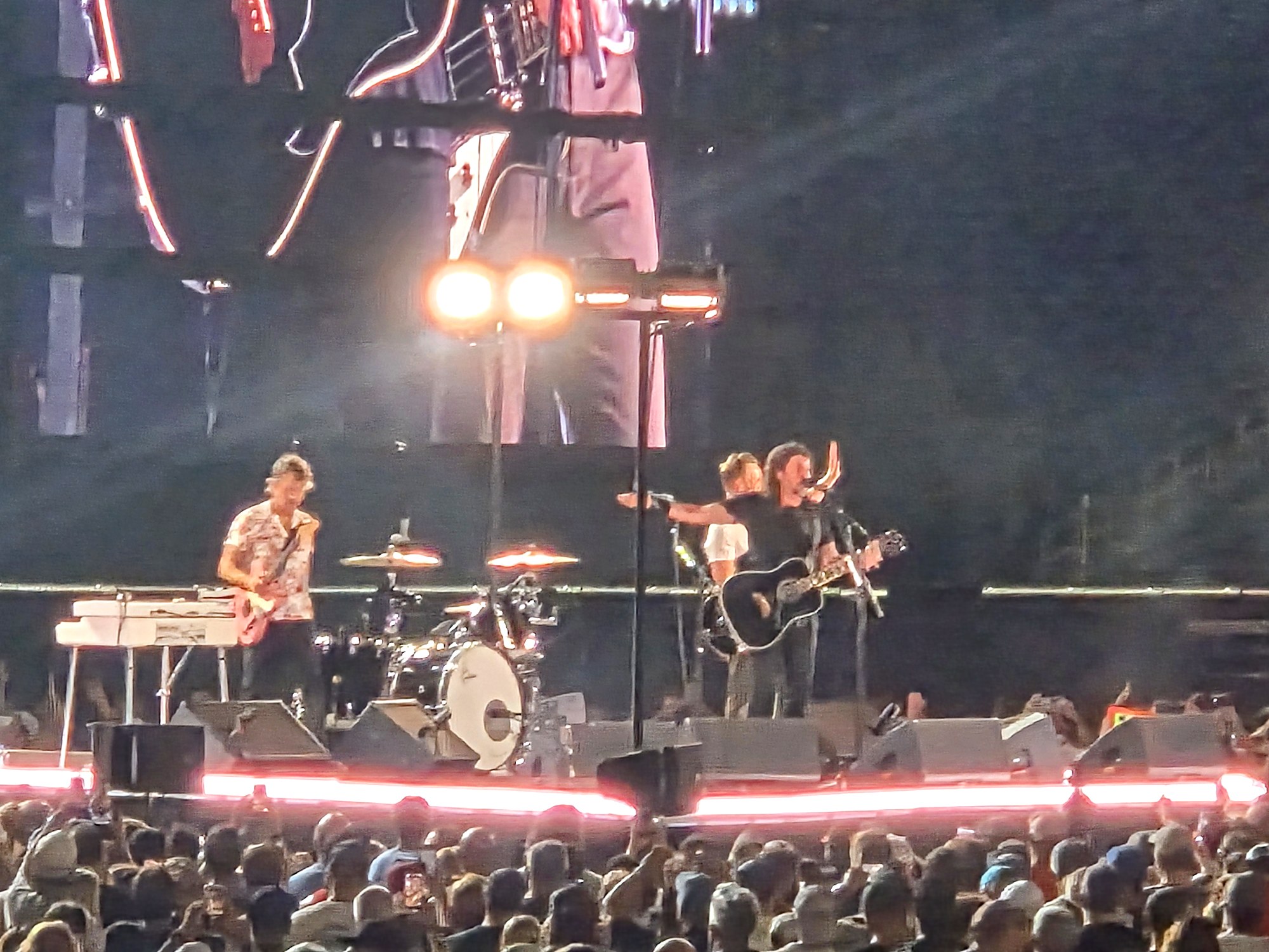 Foo Fighters on stage at Nissan Stadium with the crowd's hands raised during the venue's last concert on August 15, 2026