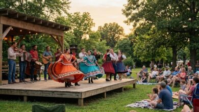 Folk dancers in brightly colored traditional costume performing on an outdoor stage as families watch from lawn chairs (illustrative)