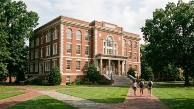 A restored early-20th-century red brick collegiate academic building with arched windows and a columned entrance on a Middle Tennessee campus (illustrative)