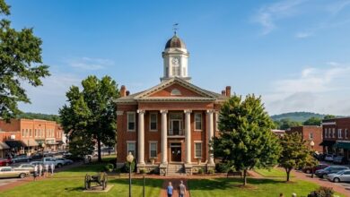Historic red brick county courthouse with white columns on a Southern town square, representing Rutherford County government (illustrative)