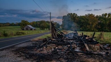 Charred remains of an old country store beside a rural Rutherford County road at dusk (illustrative)