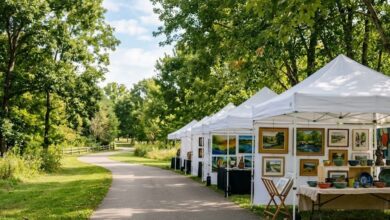 White vendor canopies lining a shaded greenway path in a Middle Tennessee city park on a September morning (illustrative)