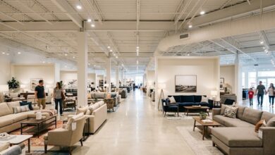 Interior of a newly opened furniture showroom in Murfreesboro, Tennessee, with staged living-room displays along a wide central aisle (illustrative)