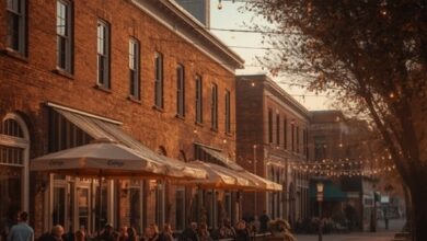 Restaurant patios and string lights on a historic Tennessee town square at dusk (illustrative)